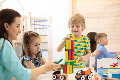 children playing with blocks at a child care center