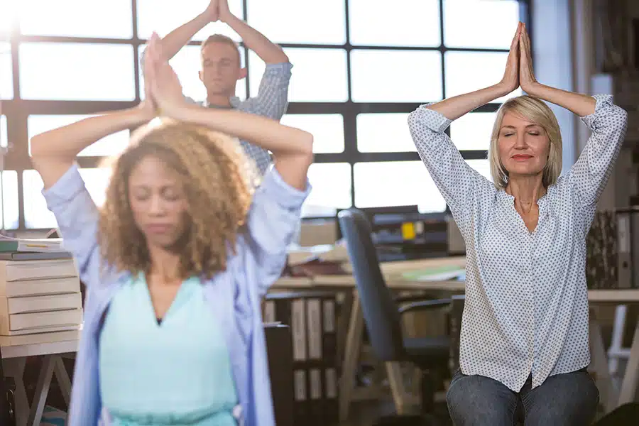 teachers doing yoga in their classroom