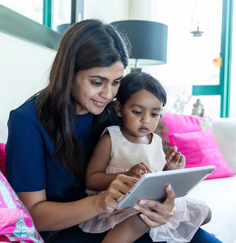 a mother and child using a tablet together