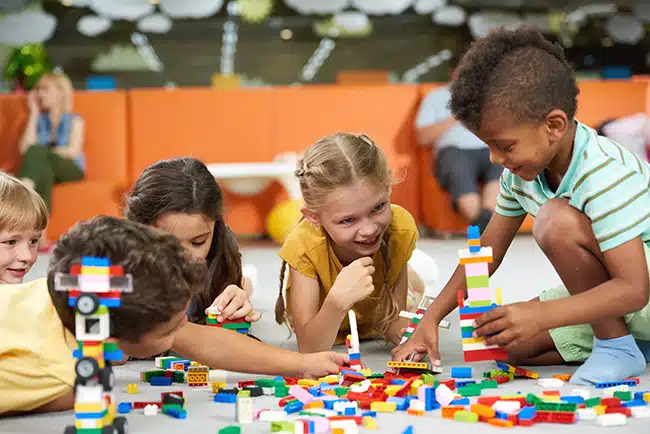children build with blocks as an example of cooperative play