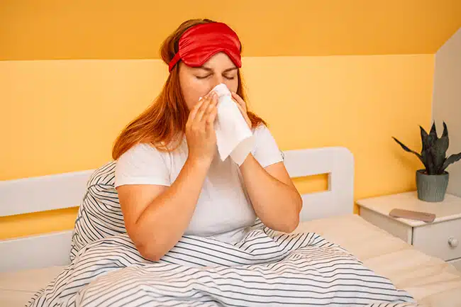 Woman stays home from work because she is sick