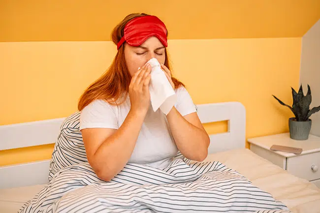 Woman stays home from work because she is sick